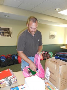 Kankakee Valley REMC employee Darrell Marks packs a backpack.
