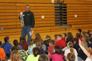 Kankakee Valley REMC employee Darrell Marks talks to students at Boone Grove Elementary about electrical safety and tree planting considerations.