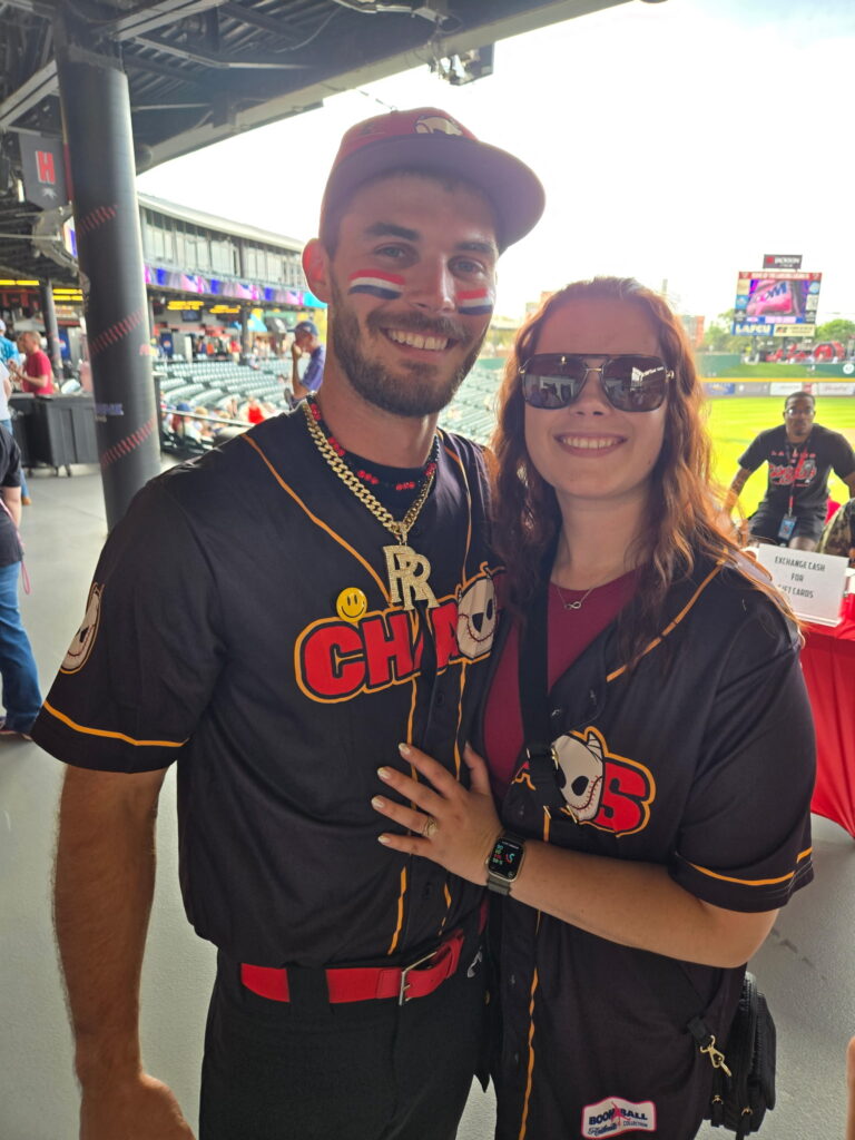 Arianna Kiernicki, Marshall County REMC Marketing and Communications Manager, poses for a photo with her husband, Boom Ball star Richie Kiernicki.