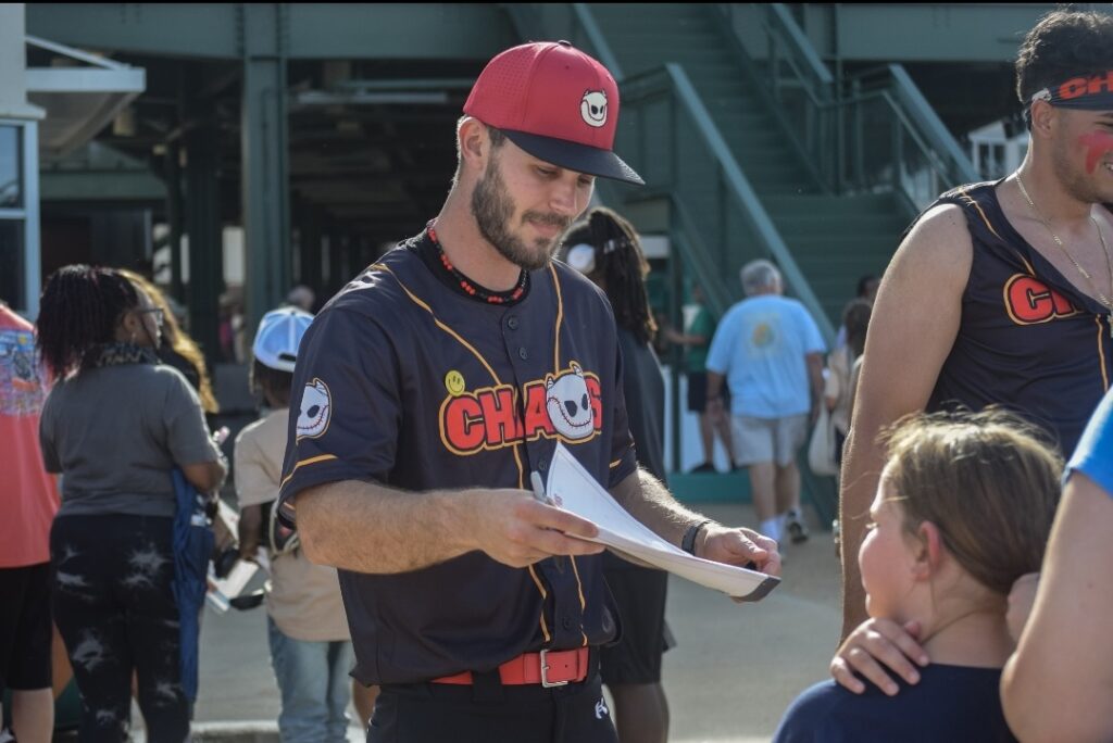 Keirnicki signs an autograph for a young Boom Ball fan